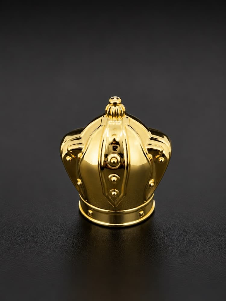Polished gold crown-shaped perfume cap
